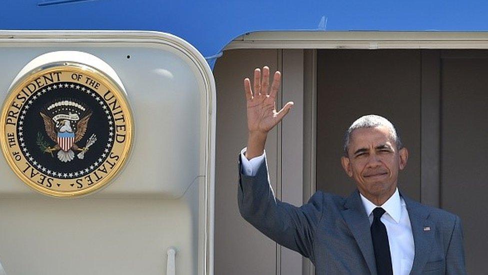 US President Barack Obama waves upon his arrival at the international airport to attend the Asia-Pacific Economic Cooperation (APEC) Summit in Manila on November 17, 2015.