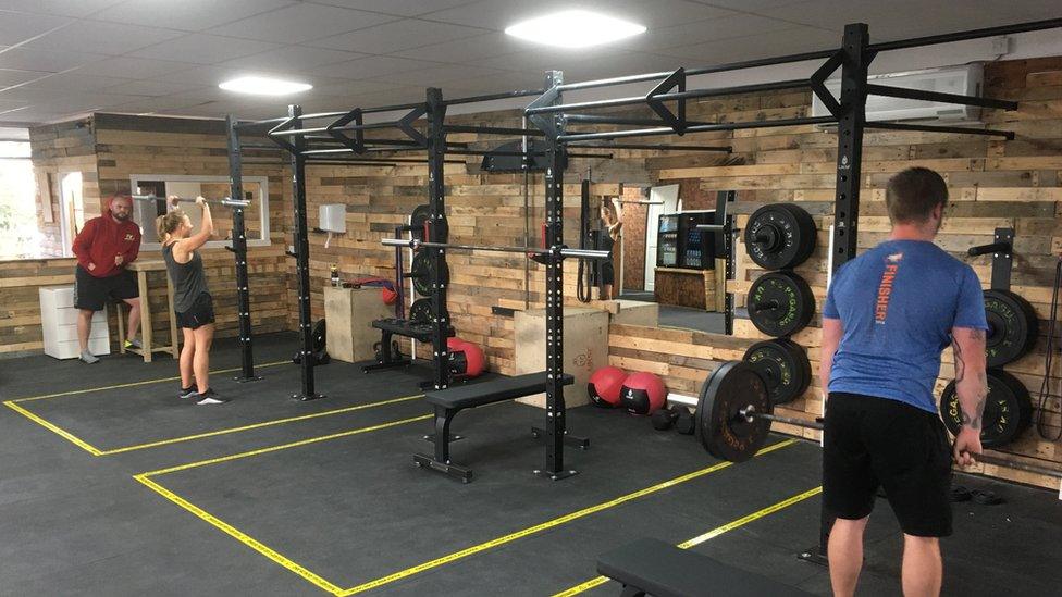 People working out in a socially distanced gym