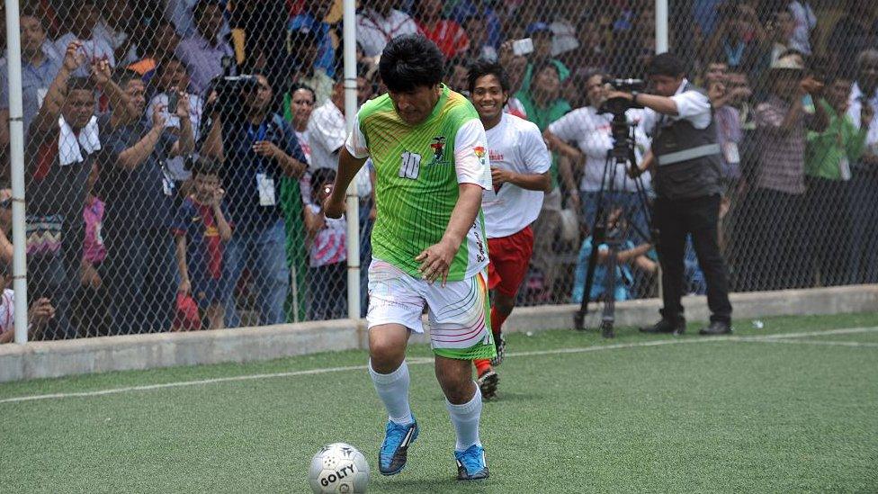 Bolivian President Evo Morales plays football during a friendly match in the framework of the Peoples Summit at the University of Panama on April 10, 2015.