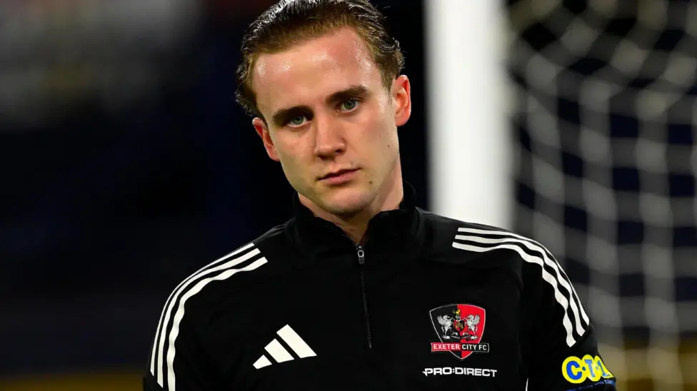 Exeter City await updates on goalkeeper Joe Whitworth's fitness after suffering leg injury 