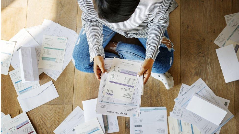 Woman looking at bills