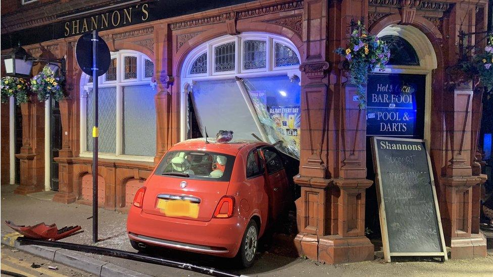 Car in collision with pub