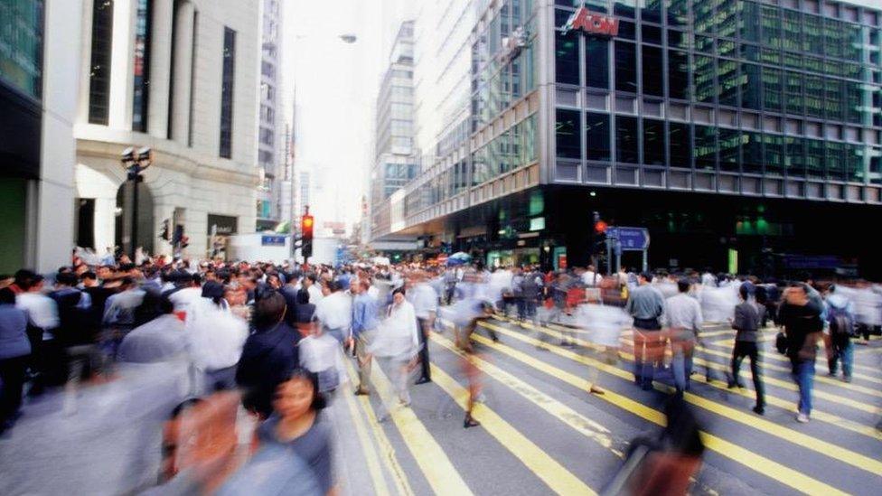 Cityscape with blurred crowd