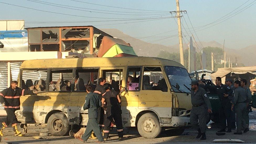 Police and fire fighters are seen at the site of a blast in Kabul June 20, 2016.