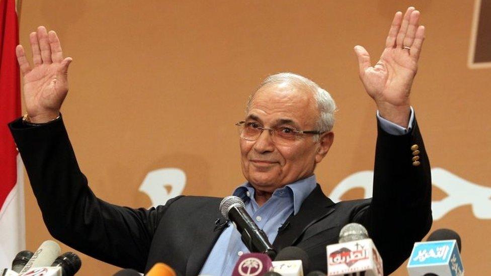 Then-Egyptian presidential candidate Ahmed Shafiq gestures while speaking during a news conference, in Cairo, Egypt, on 21 June 2012