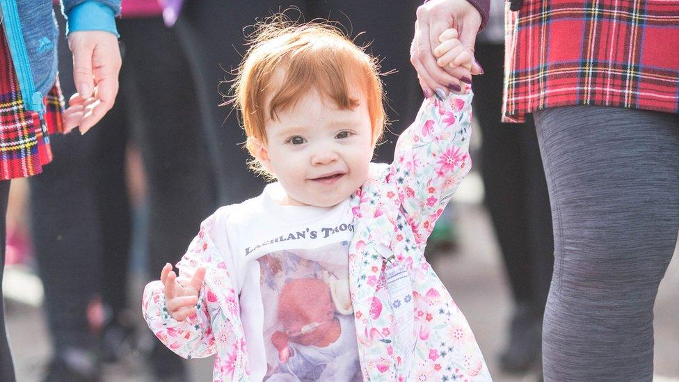 Child taking part in the kiltwalk