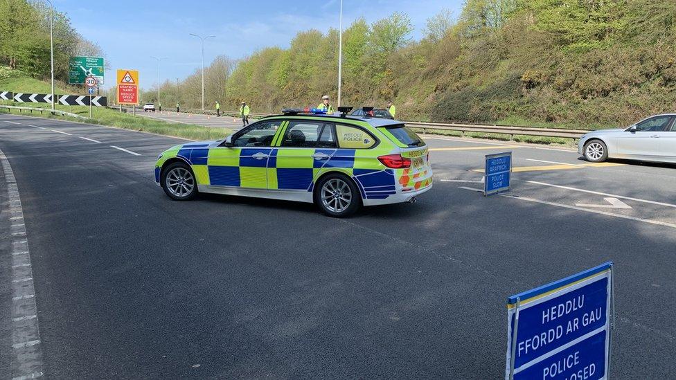 A police car at a check point on the A40