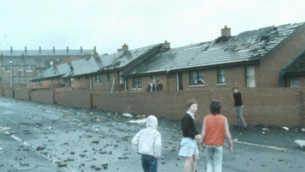 Houses with damaged roofs