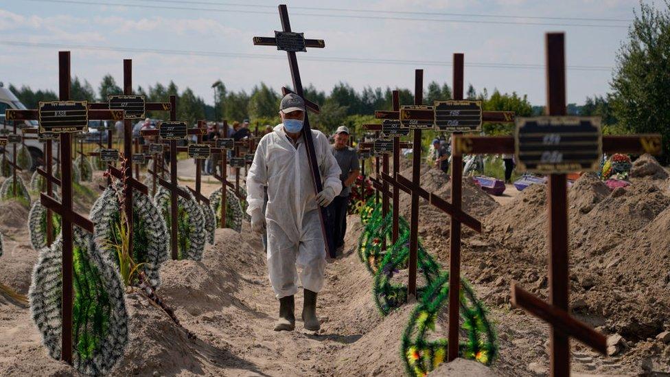 A burial ceremony for some of those bodies found near Bucha