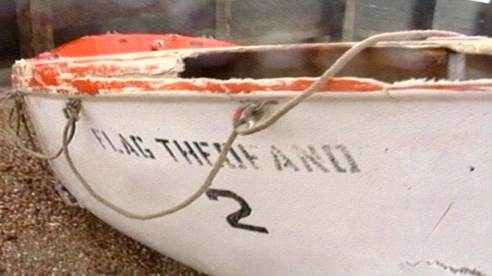 Damaged lifeboat bearing the name Flag Theofano