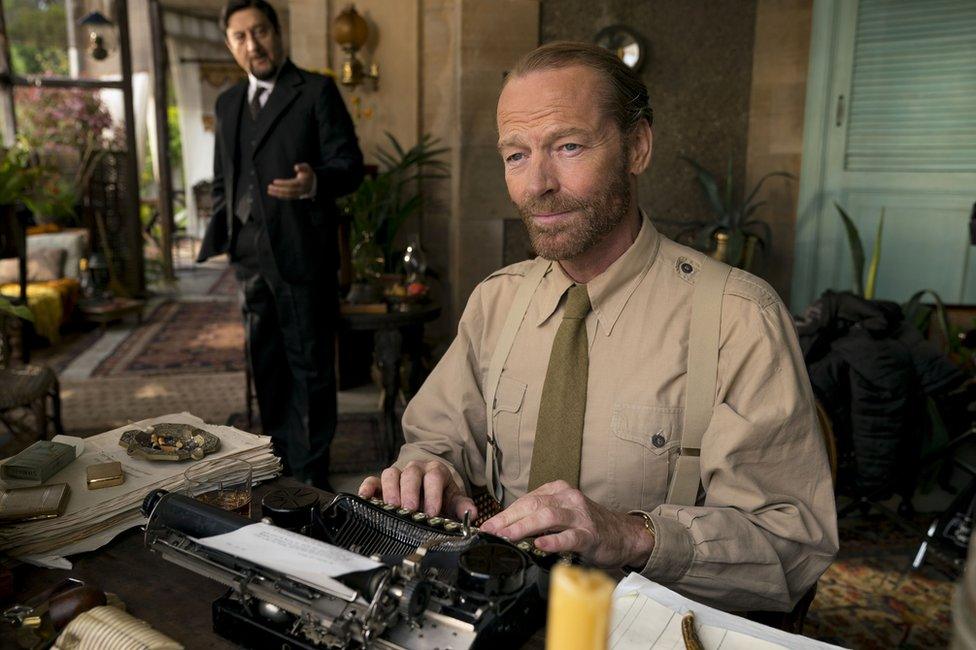 Iain Glen, as Alec Wilson, and Anupam Kher, as Shahbaz Karim