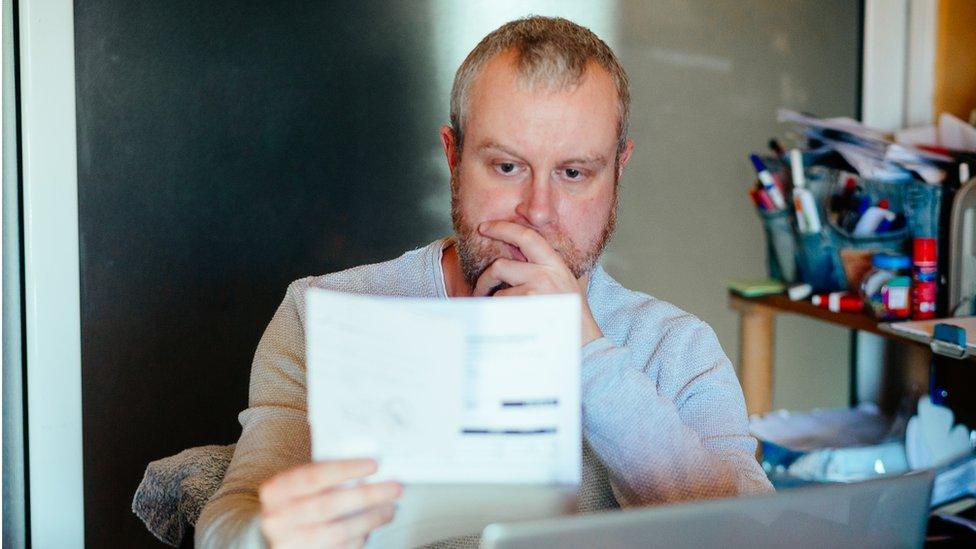 Man holding letter - stock shot