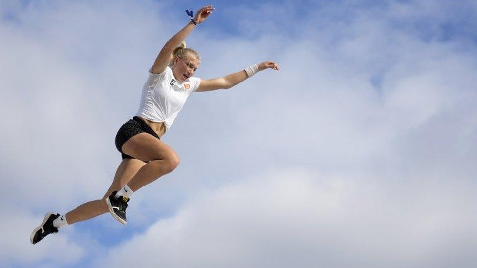 athlete jumping through the air