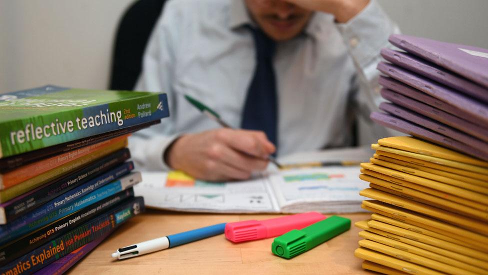 Man looking at books