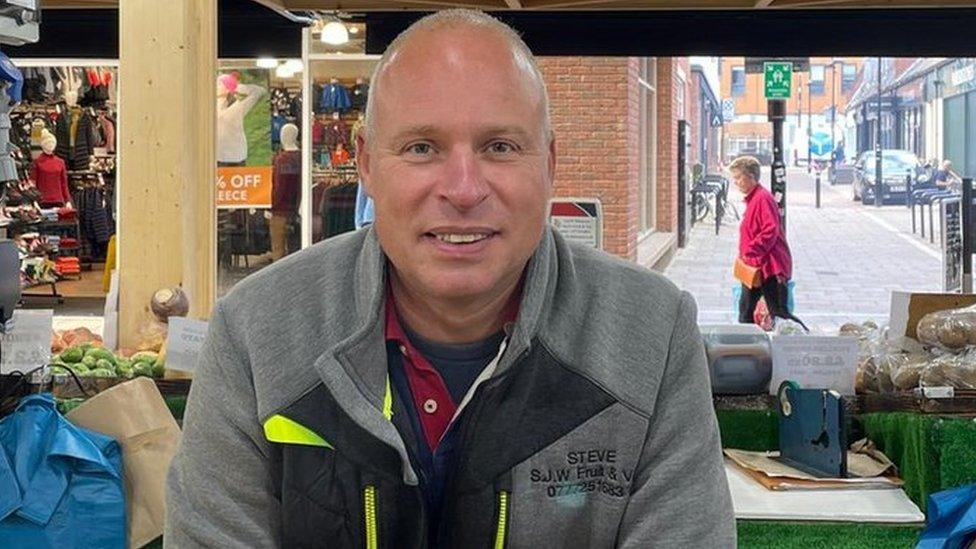 Stephen Wetherill a market trader by his stall in Peterborough