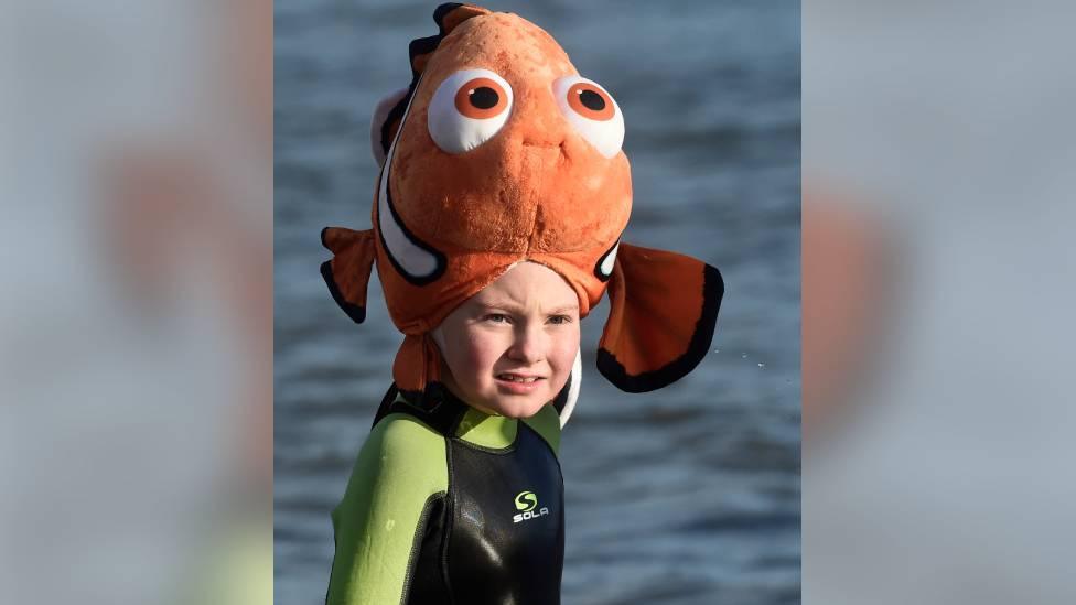 girl in fancy dress in sea