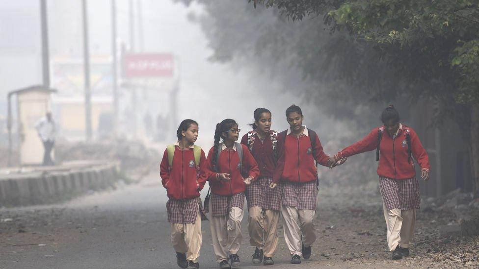 children walking in smog