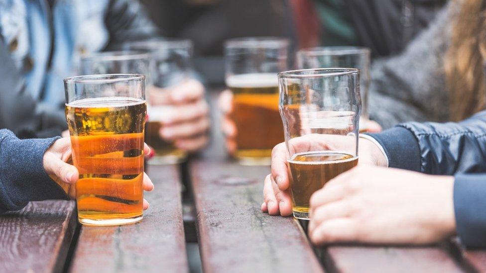 Pint glasses on table in pub