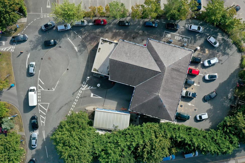 An aerial view of cars queuing for fuel