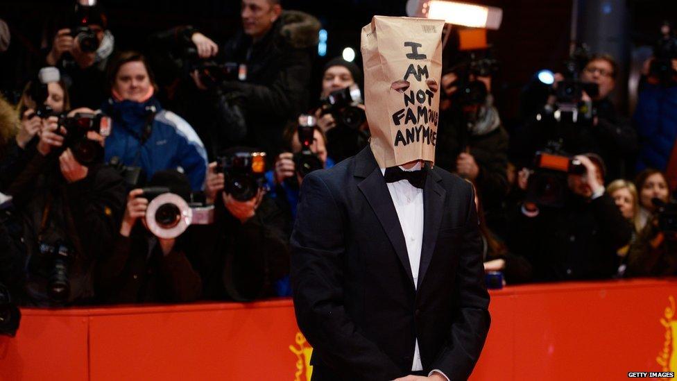 Shia LeBeouf wearing a paper bag on his head