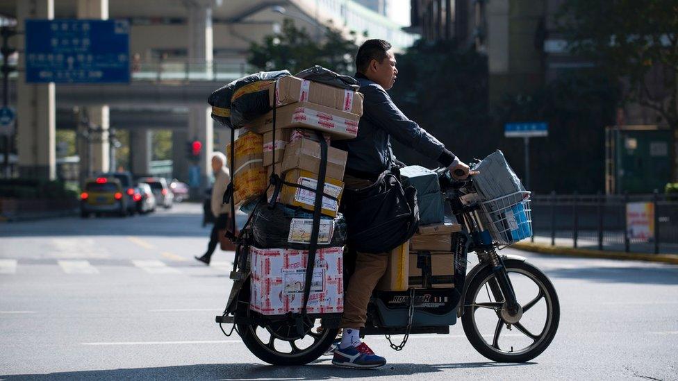 Image shows a delivery man in Shanghai on 11 November 2017