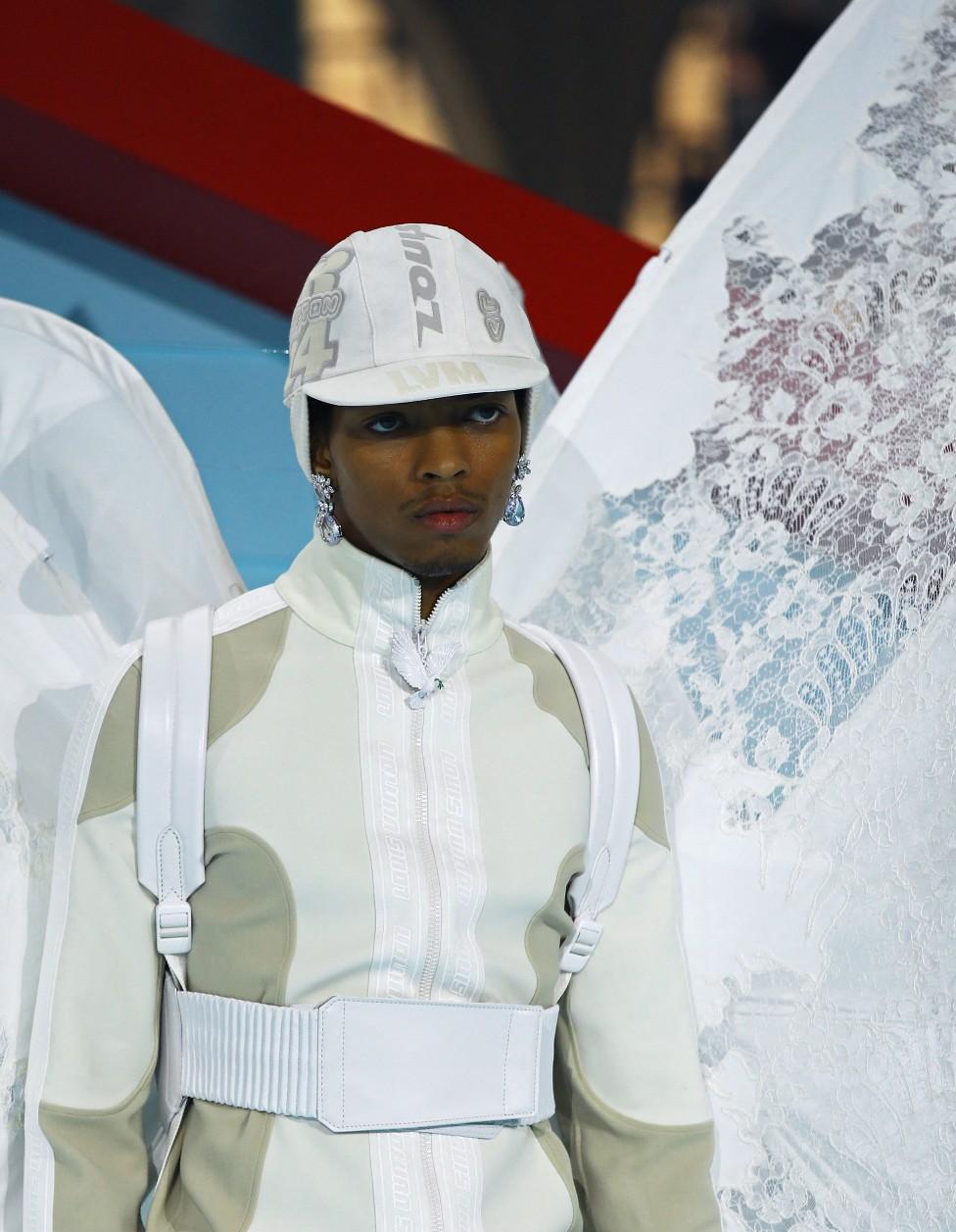 A model presents a creation by late designer Virgil Abloh as part of his Fall/Winter 2022 collection show for fashion house Louis Vuitton during Mens Fashion Week in Paris