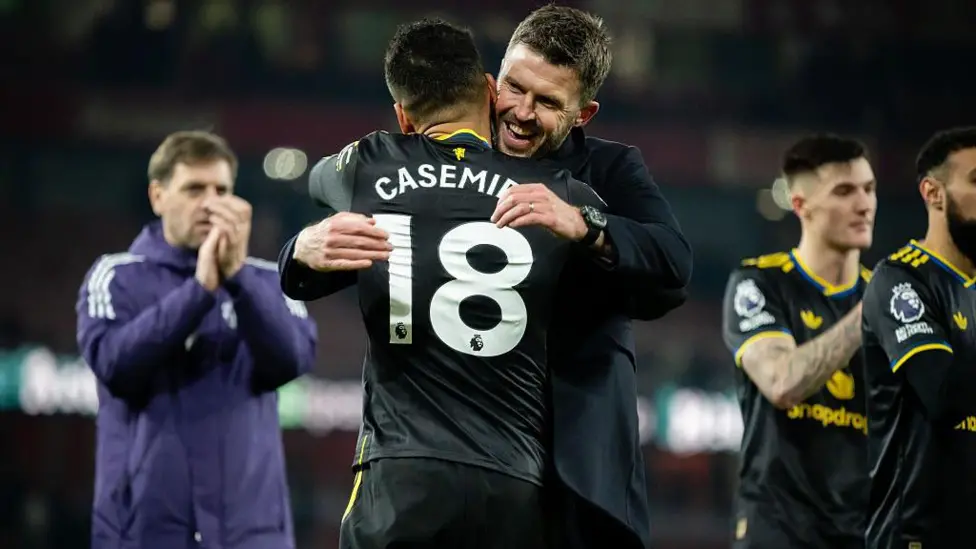 Casemiro hugs Manchester United interim manager Michael Carrick