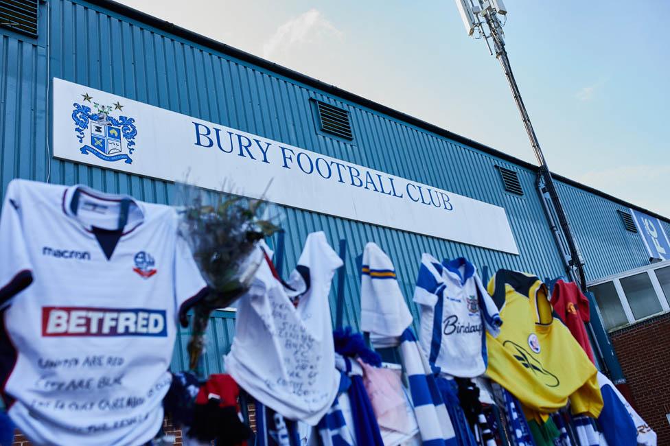 Scarves and jerseys outside Gigg Lane