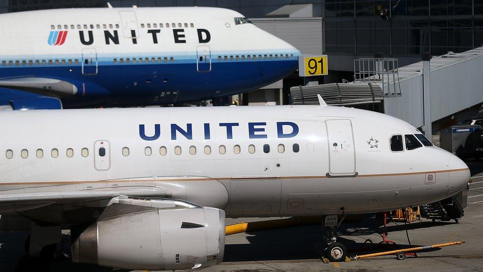 : Two United Airlines planes are parked at the terminal at San Francisco International Airport on August 24, 2012 in San Francisco, California.