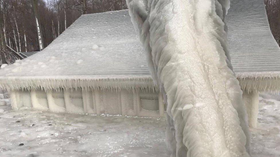 A family summer house on the shores of Lake Ontario, New York, US, has been covered in ice