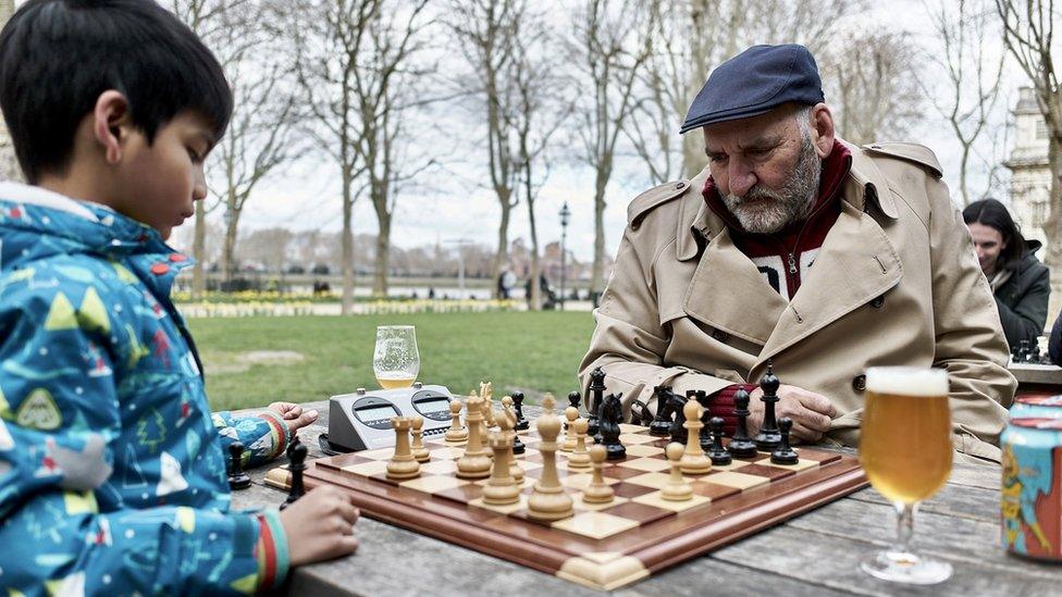 Seven-year-old Kushal Jakhria plays against an older member of the chess club