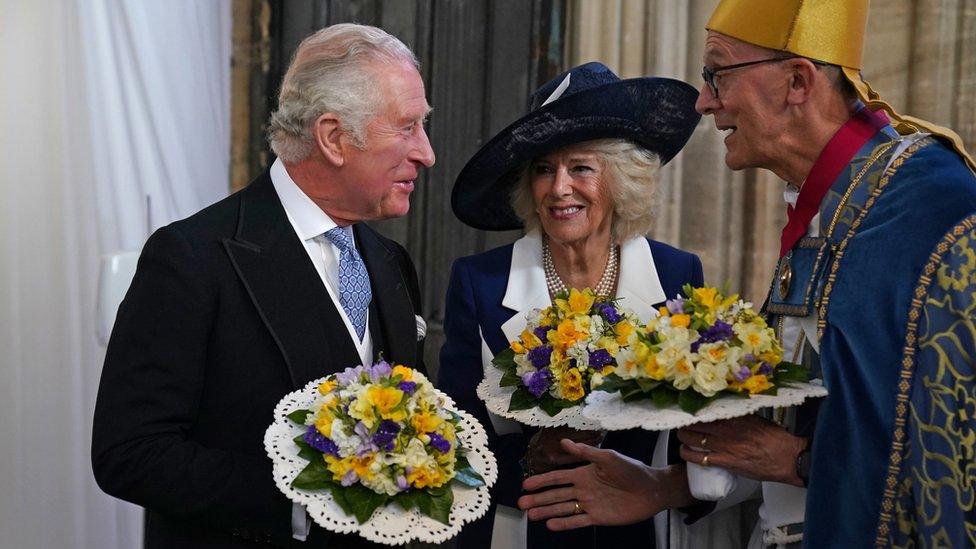 The Prince of Wales and the Duchess of Cornwall are greeted by the Dean of Windsor David Conner