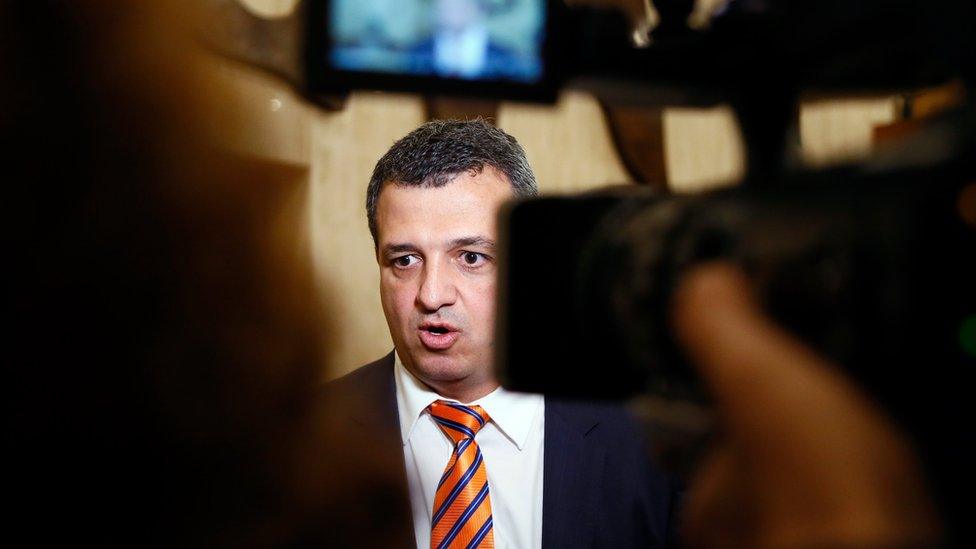 Israeli Unesco ambassador Carmel Shama Hacohen speaks to the media as he walks out of the meeting room at Unesco's headquarters in Paris