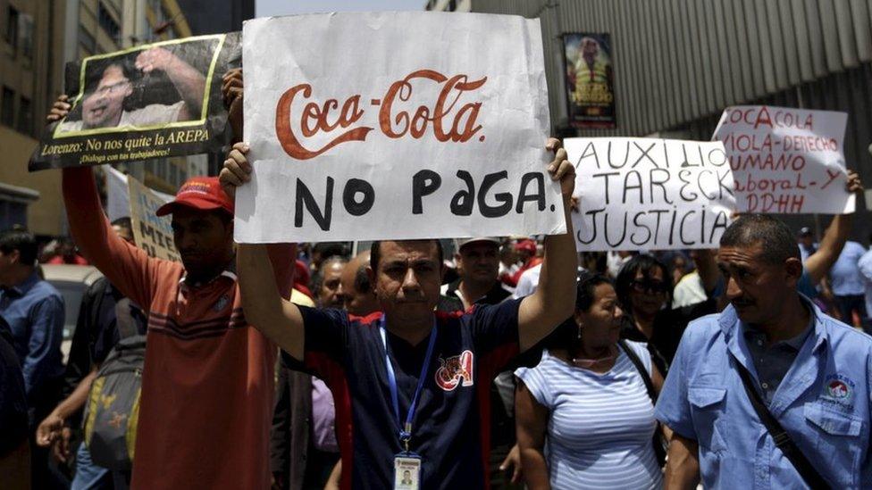 Union members of Polar's beer factory take part in a demonstration in Caracas 02 July 2015