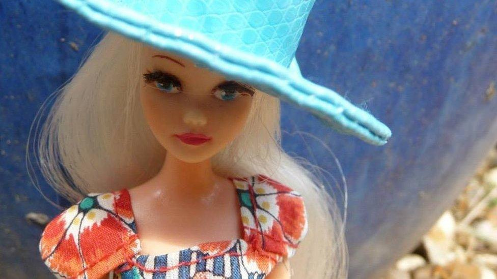 Pippa doll wearing a fancy blue hat