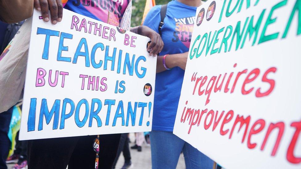 A sign at a teachers strike that reads 'Rather be teaching but this is important'