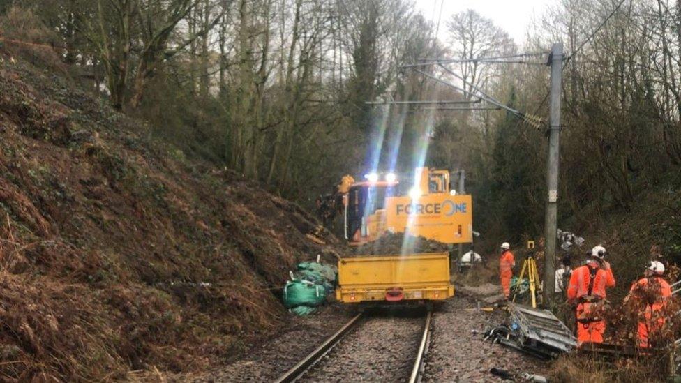 Engineers working to repair the landlsip