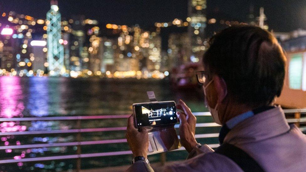 File photo of a man using a mobile phone