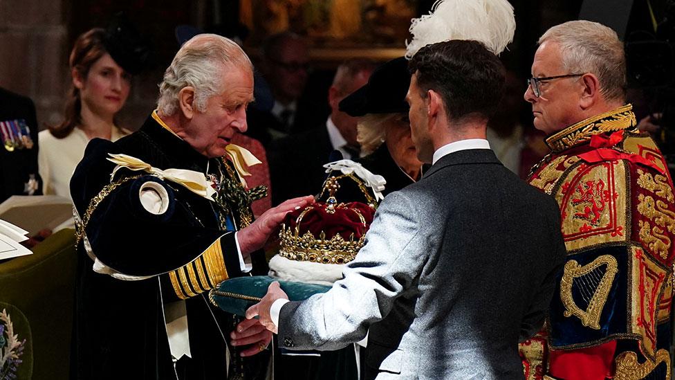 The King was presented with the crown by the Duke of Hamilton and Brandon