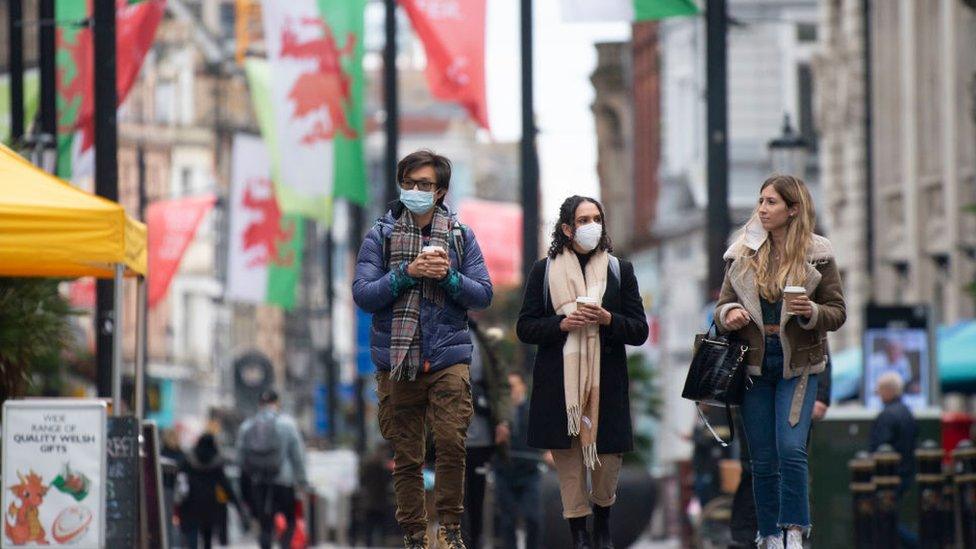 Three people walking down St Marys Street