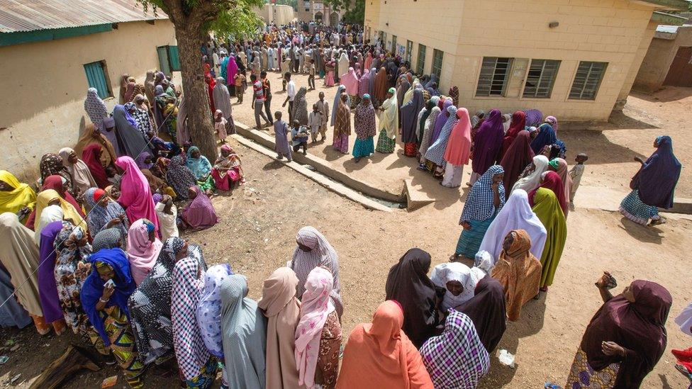 People queuing to vote