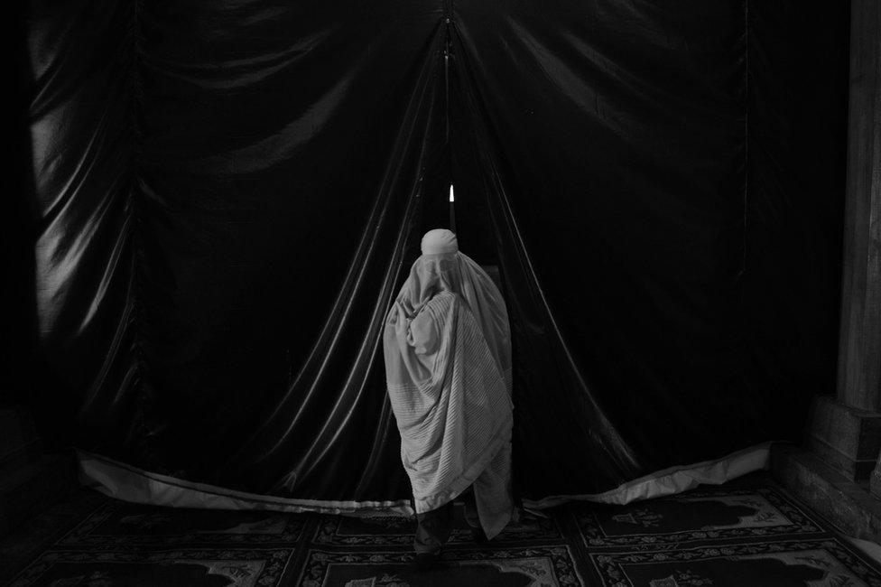 A devotee at Srinagar’s central mosque, Jamia Masjid