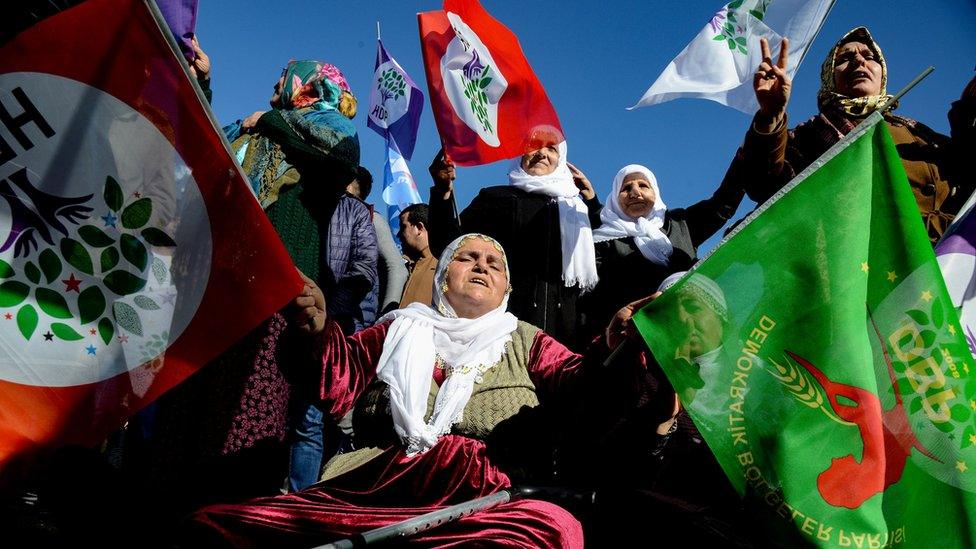 Protesters hold flags of the Peoples" Democratic Party (HDP) during a rally in the Kurdish-majority city of Diyarbakir, south-eastern Turkey, on January 19 , 2019, in support of a jailed lawmaker who has been on hunger strike for more than two months.