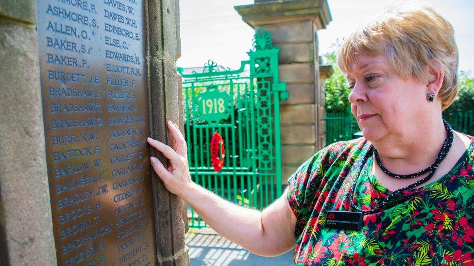 Sally Mullins with a plaque of remembrance