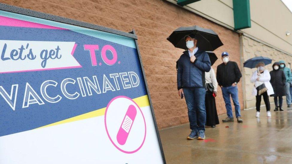 People line up for a vaccine in Toronto