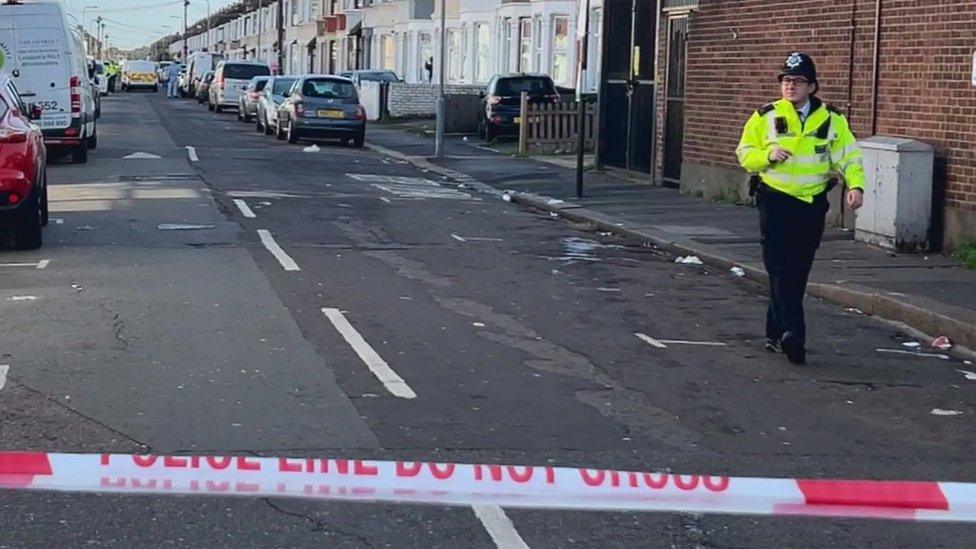 Police officer in the street at the scene of the shooting