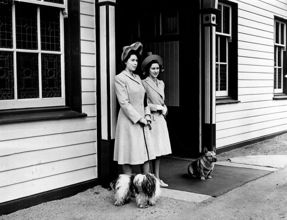 Princess Elizabeth and Princess Margaret waiting at Ballater Station, near Balmoral Castle in 1946