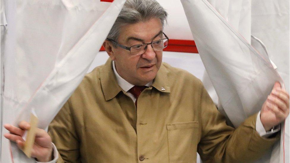 Jean-Luc Melenchon (R) leader of the "NUPES" (Nouvelle Union Populaire Ecologique et Sociale) a coalition of Leftist and Ecologist parties prepares to cast his vote in the first round of the French legislatives elections, at a polling station in Marseille