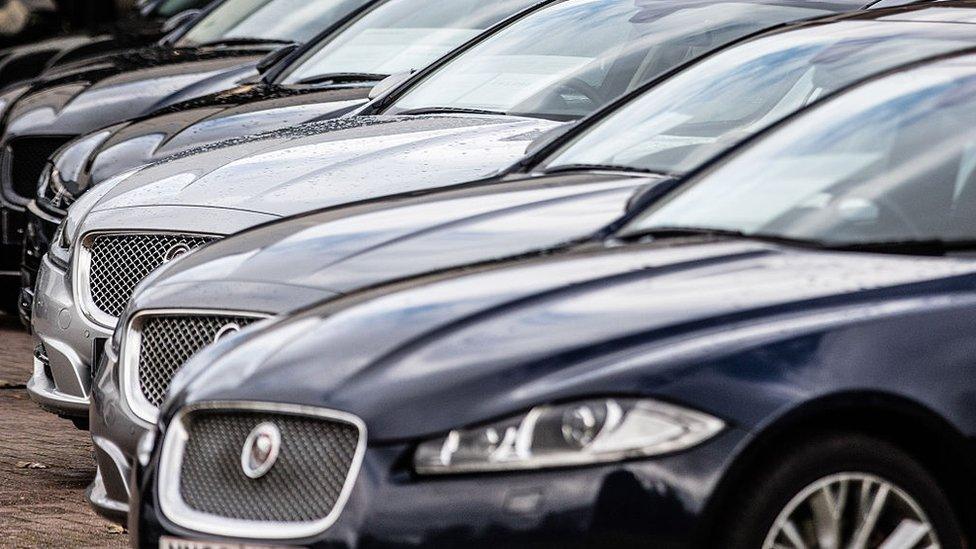 Jaguar cars for sale on a salesroom forecourt