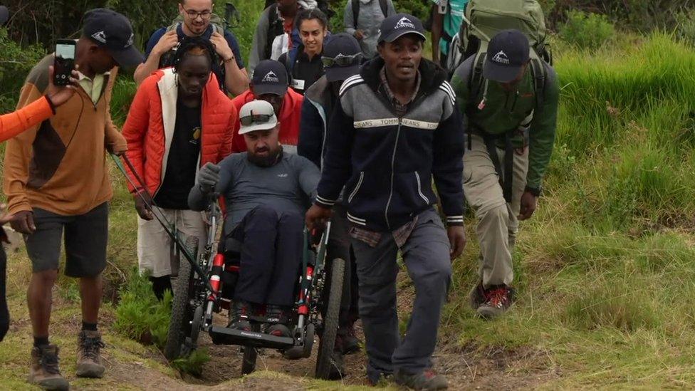 The football agent in his specially-adapted wheelchair